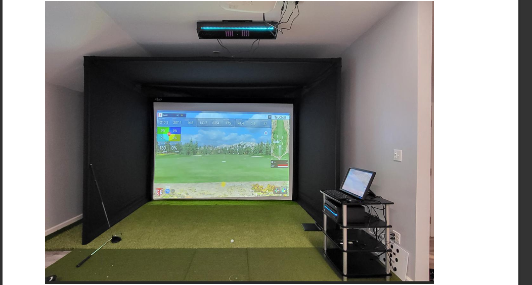 Current Domis, Inc. simulator bay with freestanding enclosure and computer station
