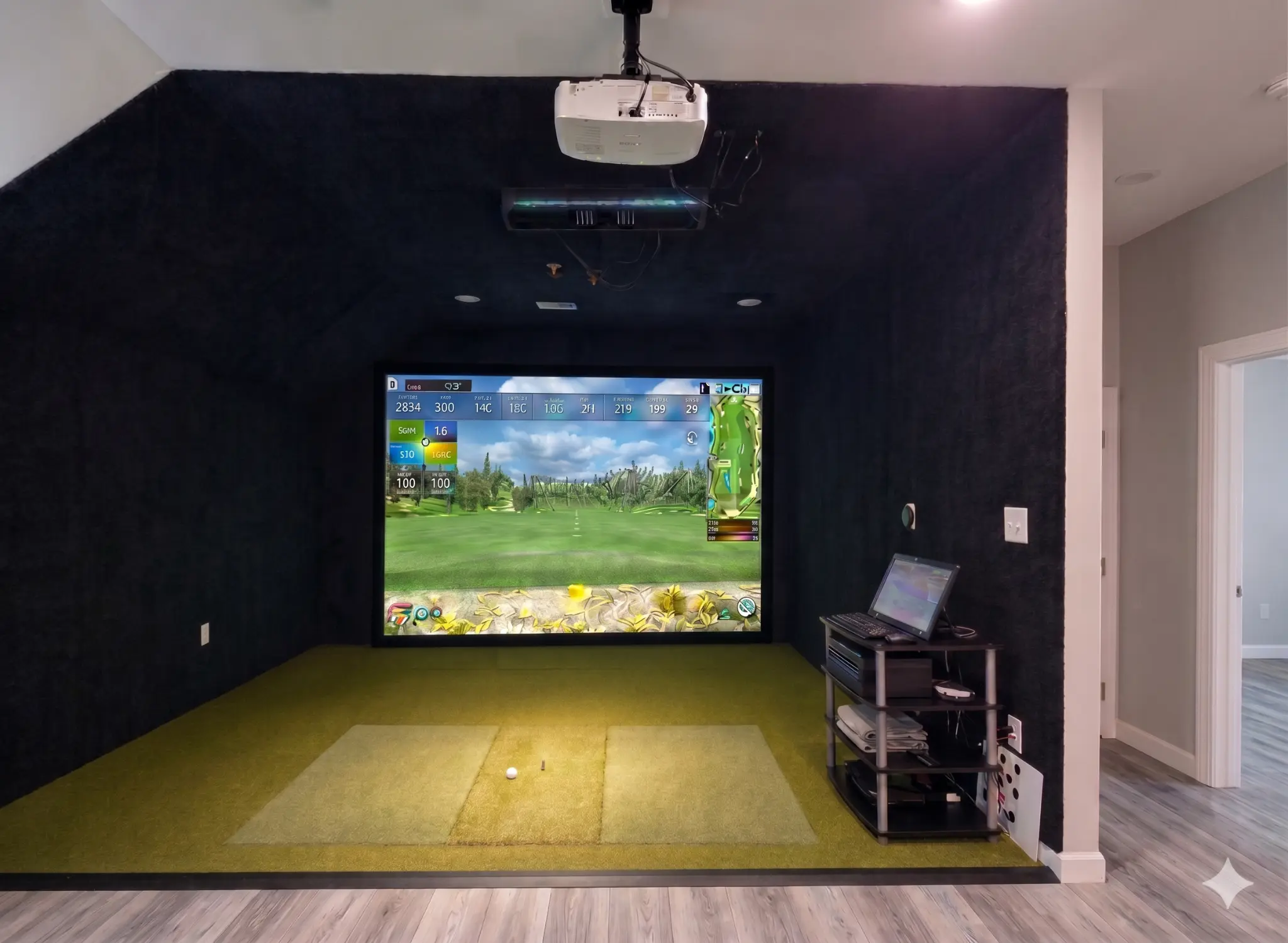 Domis, Inc. simulator bay with black wall carpet finish installed